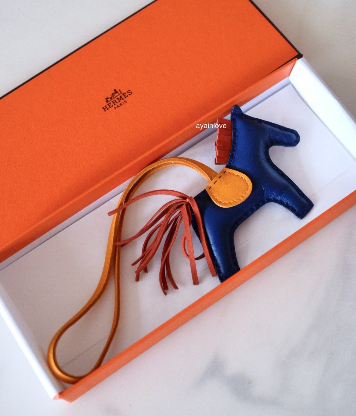 HERMES Rodeo PM Tricolour Blue Sapphire/Jaune D’Or/Natural Bouton Bag Charm