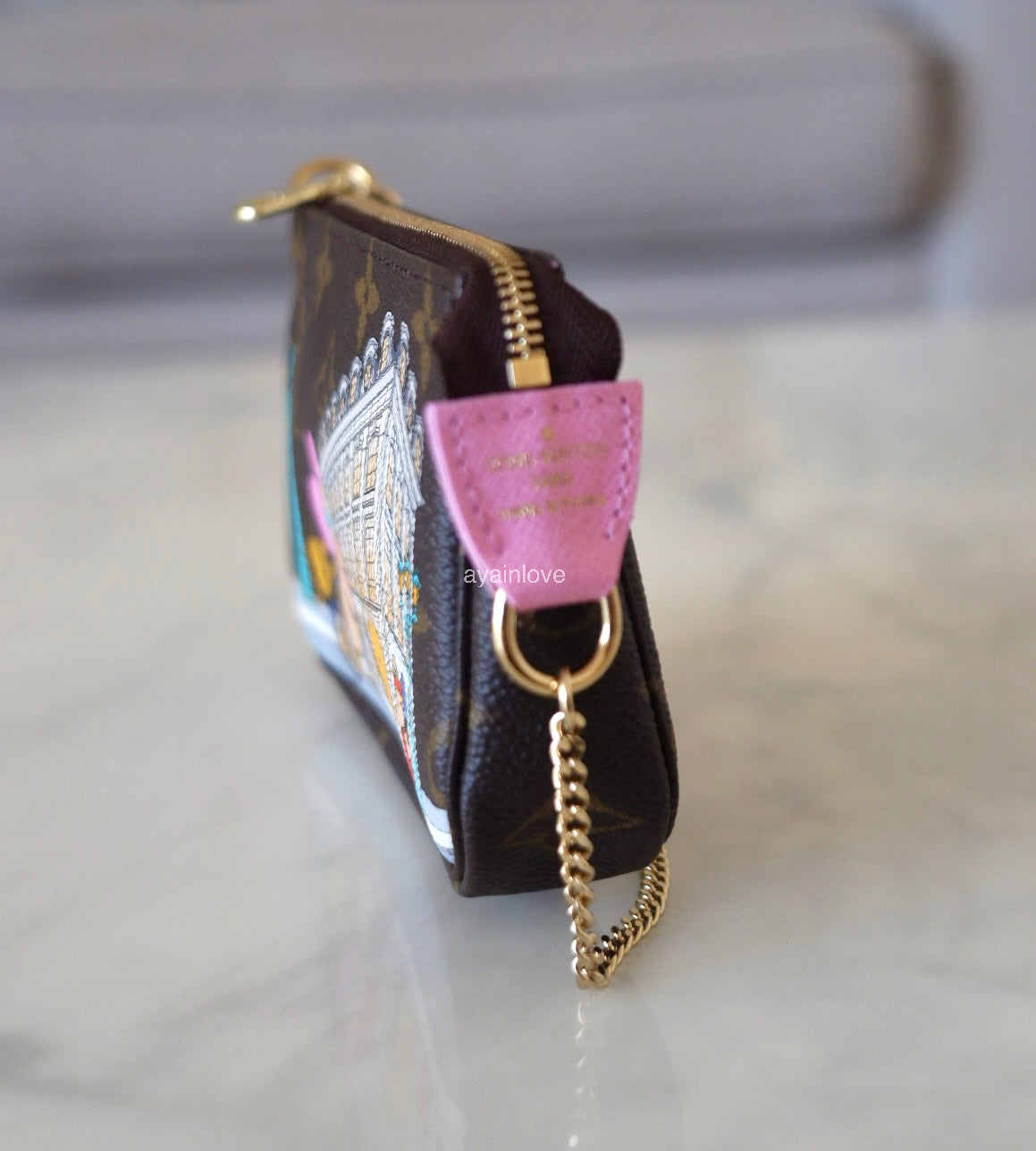 LOUIS VUITTON LV Holiday Limited Edition Vivienne Vendome Paris Animation 2022 Mini Pochette Monogram Gold Hardware