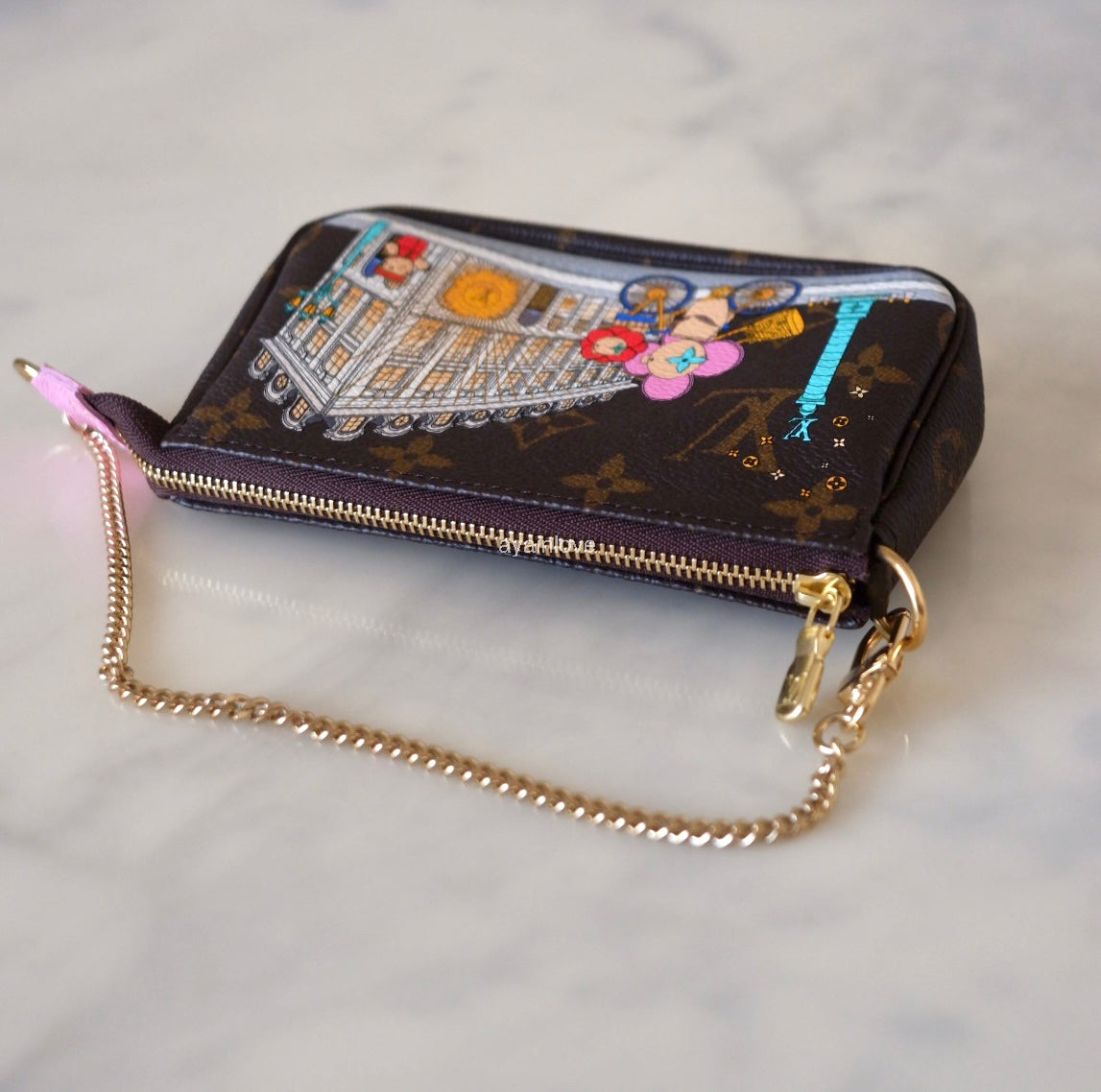 LOUIS VUITTON LV Holiday Limited Edition Vivienne Vendome Paris Animation 2022 Mini Pochette Monogram Gold Hardware