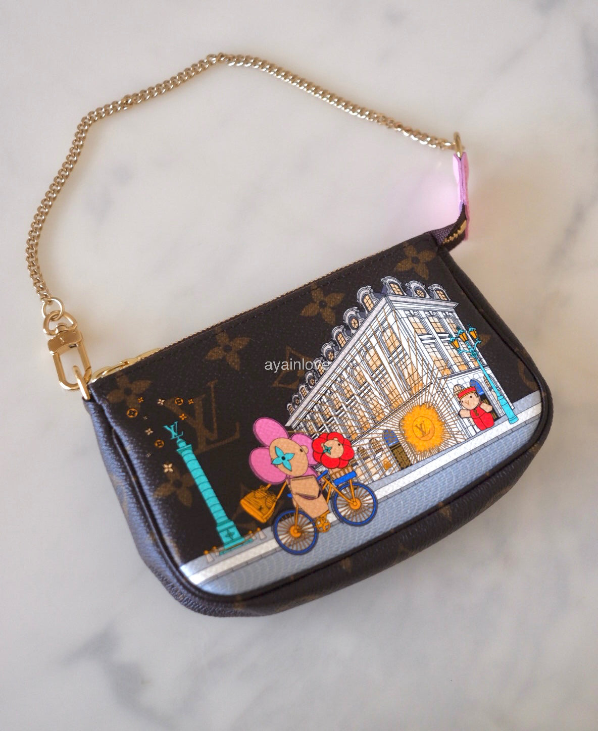 LOUIS VUITTON LV Holiday Limited Edition Vivienne Vendome Paris Animation 2022 Mini Pochette Monogram Gold Hardware