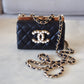 CHANEL 23A Black Lambskin CC Pearl Frame Clutch Bag Light Gold Hardware