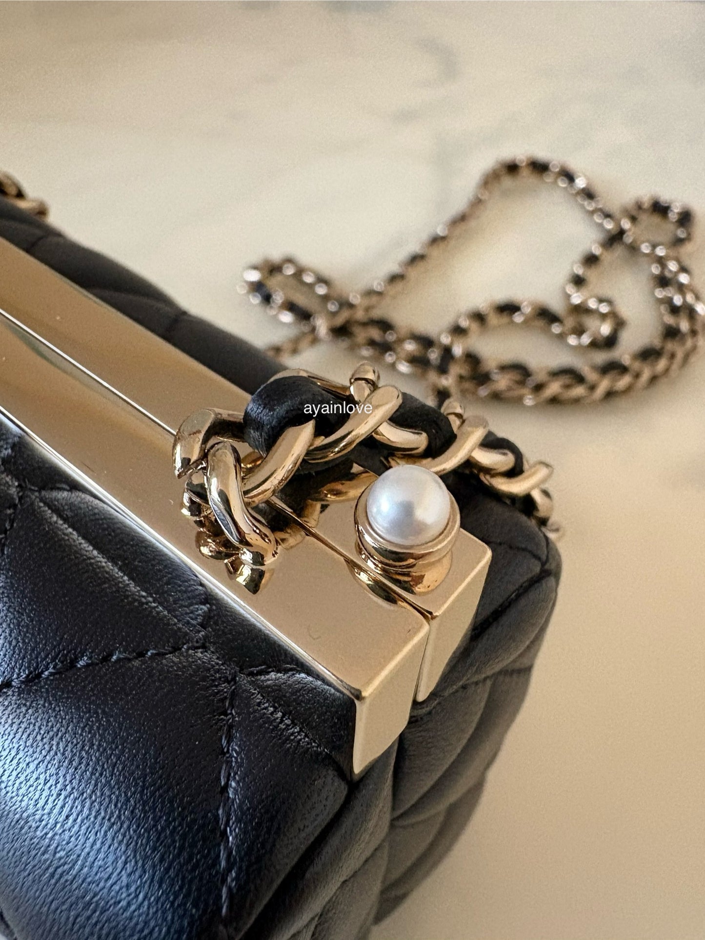 CHANEL 23A Black Lambskin CC Pearl Frame Clutch Bag Light Gold Hardware