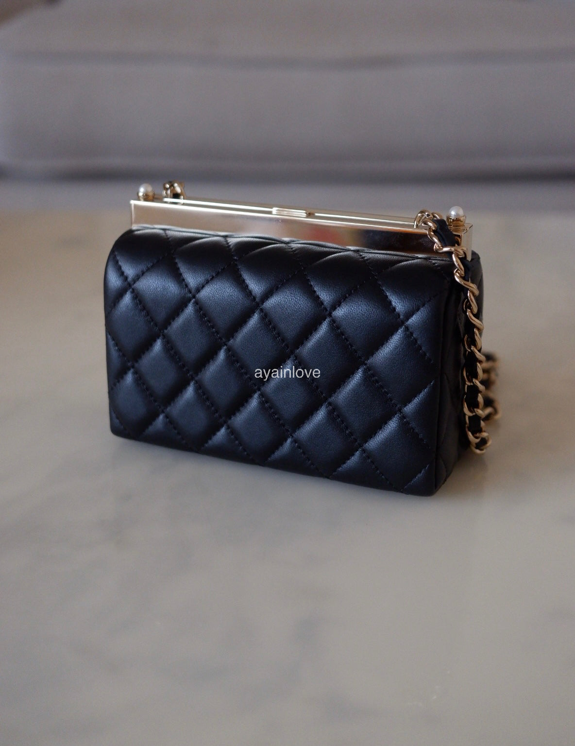 CHANEL 23A Black Lambskin CC Pearl Frame Clutch Bag Light Gold Hardware