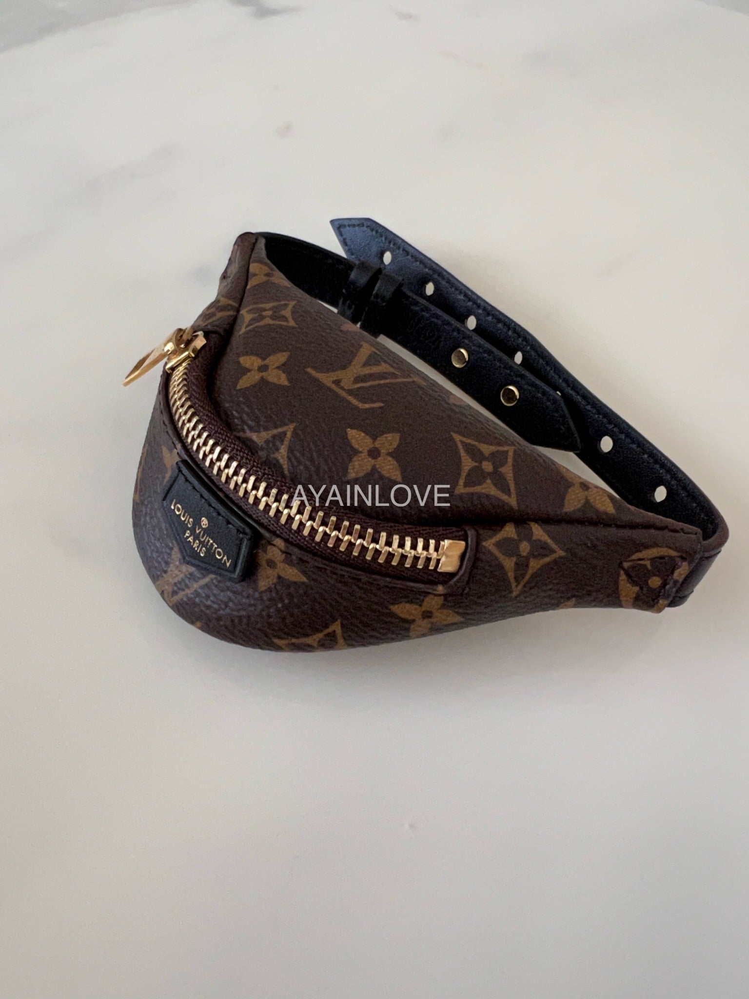 Louis Vuitton Party Bumbag Bracelet Monogram Brown in Coated Canvas/Calf  Leather with Gold-tone - GB
