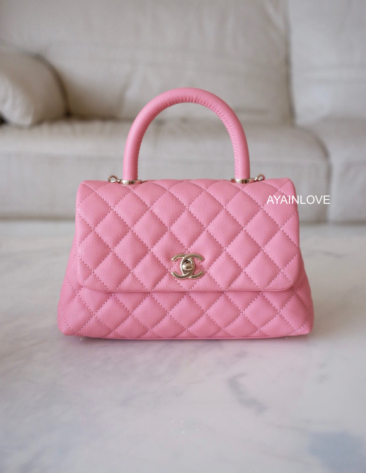 pink chanel flap bag with top handle
